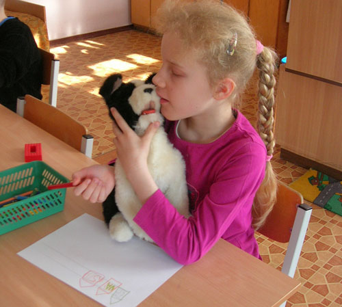 Star of hope in latvia working with special needs kids look a doggy
