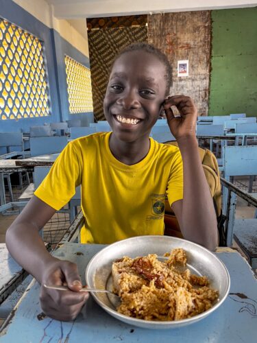 susan happy with a school lunch, not a sure thing in kenya